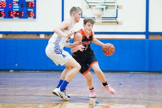 Marcus Larson/News-Register file photo##
Yamhill-Carlton freshman Moroni Roberts (1), pictured during an earlier matchup against Amity, led the Tigers to Tuesday’s 78-73 league playoff win over Blanchet Catholic. He scored 27 points and grabbed 18 rebounds in Y-C’s 16th victory. Marcus Larson/News-Register file photo##
Yamhill-Carlton freshman Moroni Roberts (1), pictured during an earlier matchup against Amity, led the Tigers to Tuesday’s 78-73 league playoff win over Blanchet Catholic. He scored 27 points and grabbed 18 rebounds in Y-C’s 16th victory.