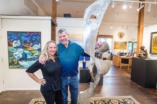 Marcus Larson / News-Register## Bradley and Heidi Lawrence will add B&B rooms to their art gallery. They re posing with an art piece called  Tall Form  by artist Tom Walsh.