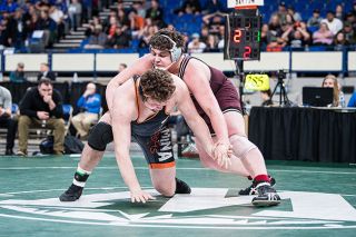 Marcus Larson/News-Register##
Dayton s Blake Larsen grapples with Willamina’s Jordan Mode during the heavyweight final. Larsen won with an 8-2 decision for his second state title. Marcus Larson/News-Register##
Dayton s Blake Larsen grapples with Willamina’s Jordan Mode during the heavyweight final. Larsen won with an 8-2 decision for his second state title.