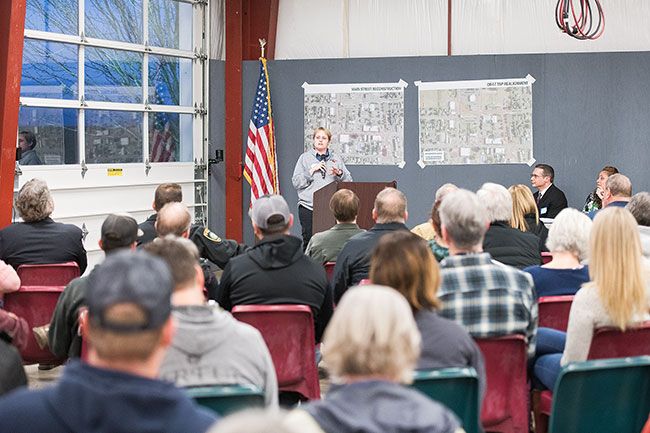 Rusty Rae / News-Register##
Alissa Loberg, road designer for the Oregon Department of Transportation, addresses a capacity crowd in the Carlton fire hall Wednesday night. About 175 area residents came out to hear about ODOT’s plans to redo Main Street.