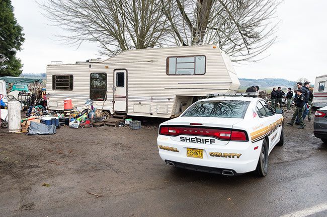 Marcus Larson/News-Register##
Several sheriff deputies arrived Thursday afternoon to tell men to leave the Hendricks Road property or face arrest. They drove away, and the site was turned over to representatives of the estate.