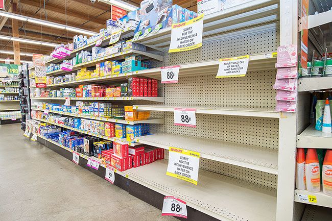 Marcus Larson/News-Register
##
Distilled water is completely sold out and on back order at Bi-Mart. Other stores also have run out of products as area residents rush to buy items that might protect them from viruses.