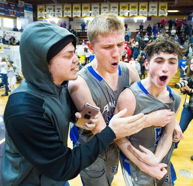 Marcus Larson/News-Register##
Amity s Michael Duncan celebrates his game-winning three-pointer against Dayton in the Class 3A state semifinals.