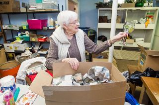 Marcus Larson / News-Register ##
Donna Reynolds examines a pretty glass as she sorts through household items donated for the Presbyterian Church rummage. She said she’s seen some unusual items during the sorting process, such as a Swedish rubber band. Marcus Larson / News-Register ##
Donna Reynolds examines a pretty glass as she sorts through household items donated for the Presbyterian Church rummage. She said she’s seen some unusual items during the sorting process, such as a Swedish rubber band.