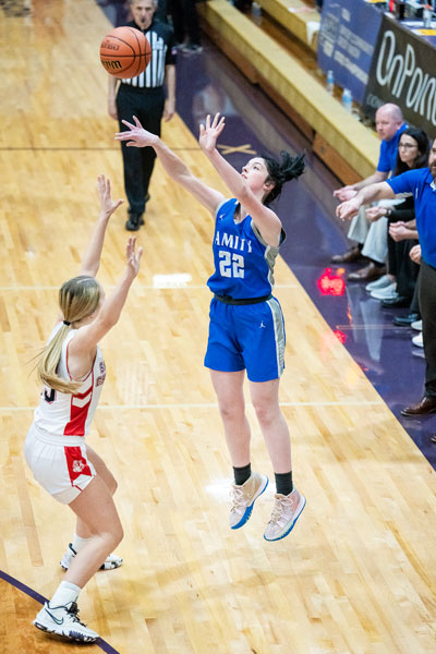 Marcus Larson/News-Register##
Amity junior forward Kylie Kendall drains a long three-pointer during the fourth/sixth place matchup against Santiam Christian.