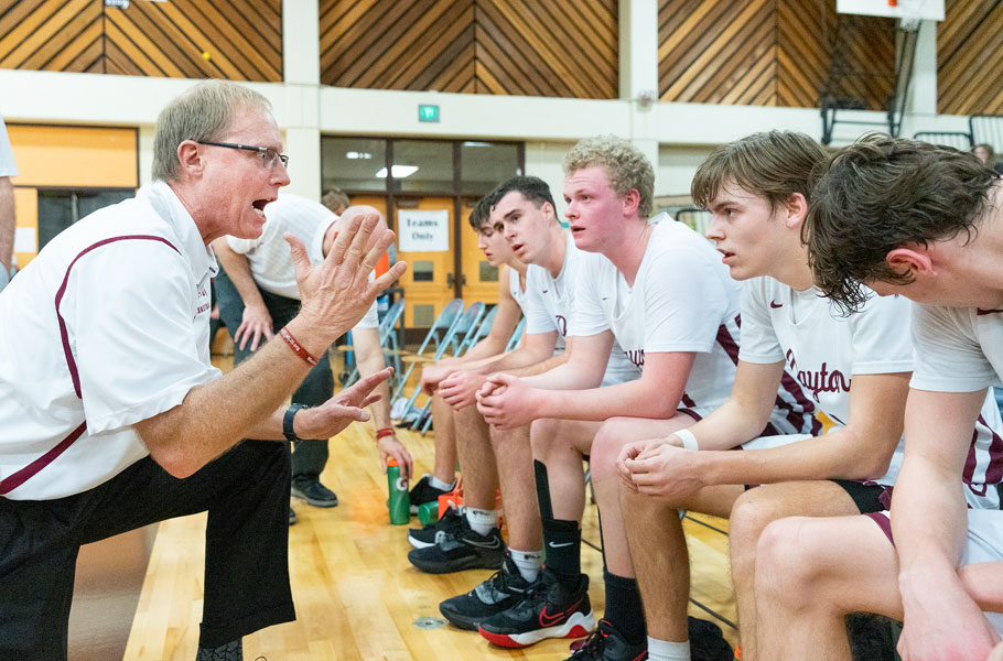 Marcus Larson/News-Register##
Dayton s longtime head boys basketball coach Ron Hop addresses his team during its quarterfinal game against Vale.