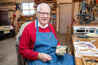 Marcus Larson/News-Register## Woodcarver Bob Lunt spends time in his garage workshop, where he create all his figures.