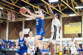 Marcus Larson/News-Register##
Amity’s Landon Distler goes up for the lay-in during the Warriors’ game against De La Salle. Marcus Larson/News-Register##
Amity’s Landon Distler goes up for the lay-in during the Warriors’ game against De La Salle.