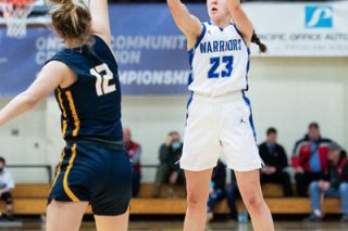 Marcus Larson/News-Register##
Amity junior point guard Ellie McMullen drains a three-pointer during the Warriors’ postseason run in Coos Bay.