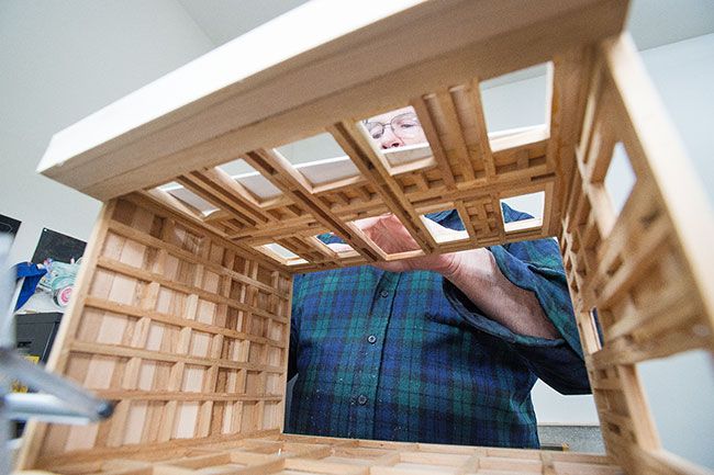 Marcus Larson/News-Register ## Dunk works on a model of an old-time wooden building that will contain a tiny dentist office.