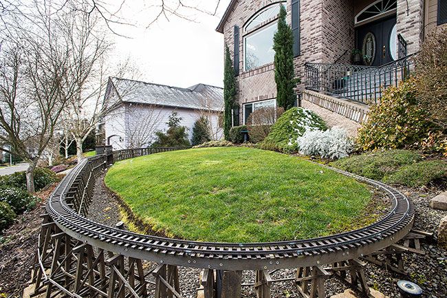 Marcus Larson/News-Register ## Dunk built 72 feet of trestle, a bridge and track for the B&R railroad that circles his front and side yards in McMinnville.