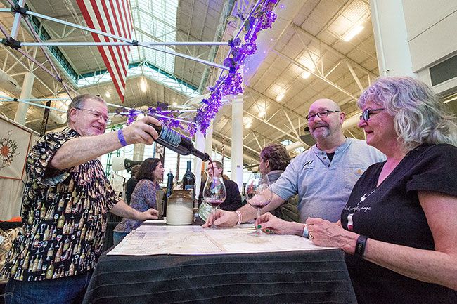 Marcus Larson/News-Register ##
Bill Sanchez pours a selection of 2015 Cabernet Sauvignon from Potter’s Vineyard for patrons Janet and Rick Imholte during last year’s SIP! event.