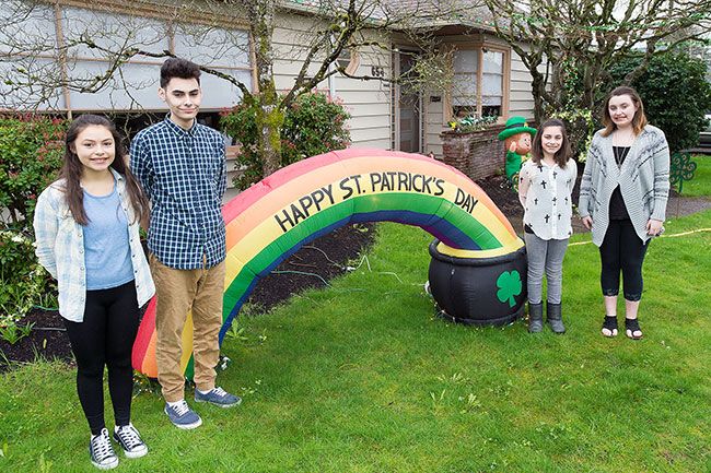 Marcus Larson/News-Register##Felicity, Ricky, Naomi and Valentina Edwards stand in their yard, which they helped their mother, Michelle, decorate for St. Patrick s Day. Not pictured is Burgundy. The family goes all out for every holiday.