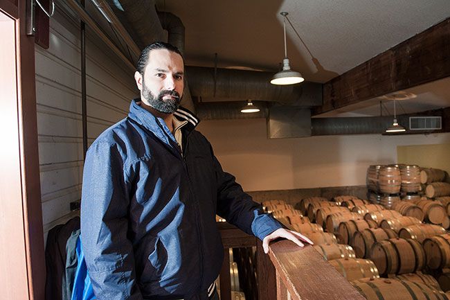 Rusty Rae/News-Register ## Beaux Frères’ logistics coordinator, Luis Figueroa, stands overlooking the barrel room.