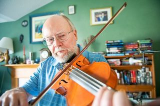Rusty Rae/News-Register ## David Dalton plays one of the 26 violins he’s made over the last 20 years.