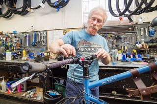 Marcus Larson/News-Register##
Tommy s Bicycle Shop owner Pat Vala works on a bike in the shop on Third Street. He has owned the business for 42 years.