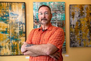 Rusty Rae/News-Register##Artist Ray Massini started out making architectural drawings, then freed himself to create abstracts. Some of his work hangs in the Ten Oaks Gallery in McMinnville.