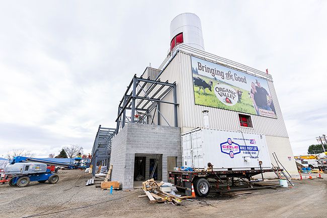 News-Register file photo##Crews rebuild the Organic Valley Creamery on Highway 99W in McMinnville, heavily damaged by fire in April 2021.