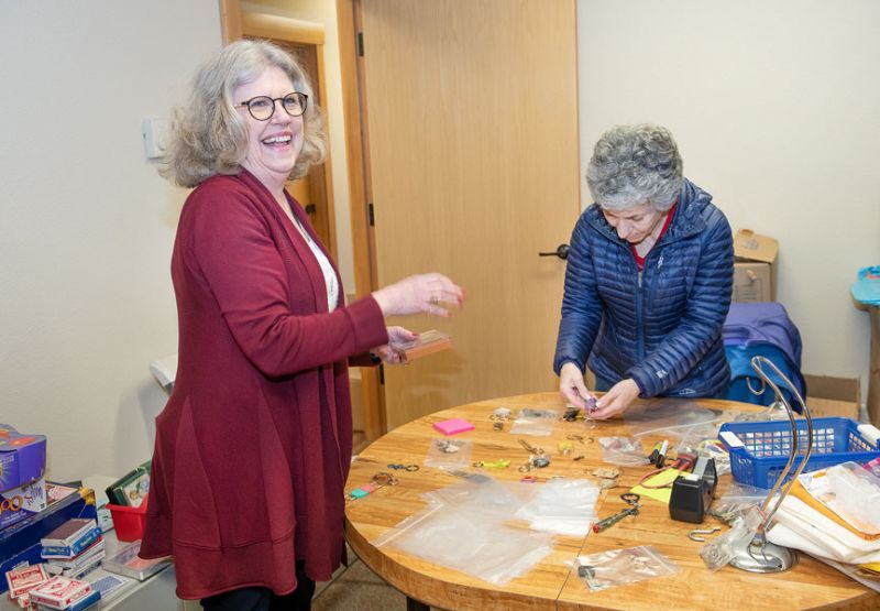 Rusty Rae/News-Register ## Volunteers Lois Costing and Beth Frischmuth sort key chains at Swedemom. Some will be resold as-is; others will be broken down into parts for “steampunk” designers.