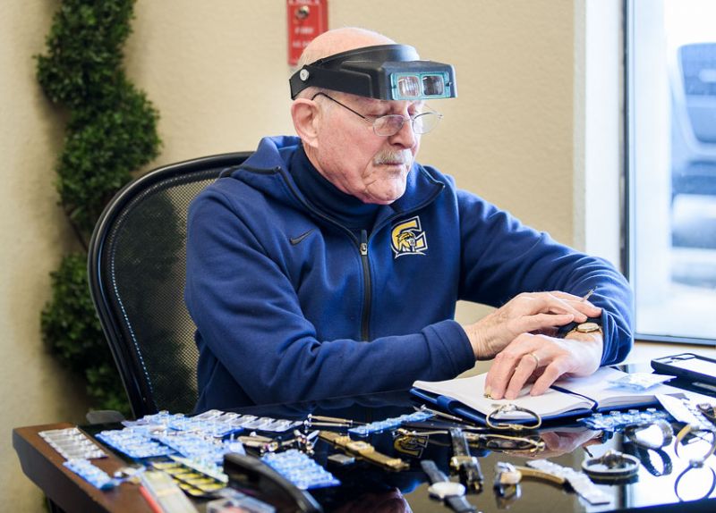 Rusty Rae/News-Register ##  Norm Berney works on watches during “volunteer Wednesday.”