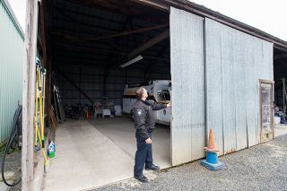 Marcus Larson/News-Register##
Carlton Police Chief Kevin Martinez demonstrates the low quality of the department s car garage that is need of an upgrade.