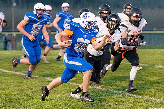 Marcus Larson/News-Register##
Amity running back Austin Flynn breaks a long run against Willamina. Flynn, in his first career start, totaled 95 rushing yards.