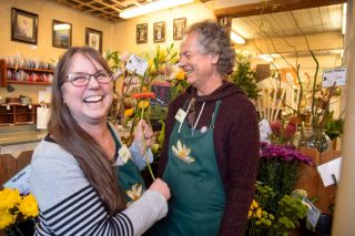 Rusty Rae/News-Register##Janet Gahr and Brian Bailey enjoy a laugh in the business they’ve owned for more than 35 years, Incahoots. They enjoy greeting customers and working with the plants and gifts available in their shop at 905 N.E. Baker St., McMinnville.