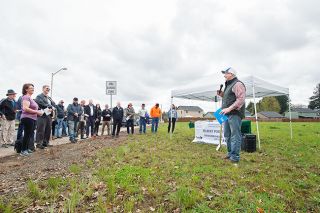Marcus Larson / News-Register##Darrick Price, president of Fishbone Construction and the nonprofit Housing People, details plans for a new subdivision in Dayton during a groundbreaking ceremony Tuesday.