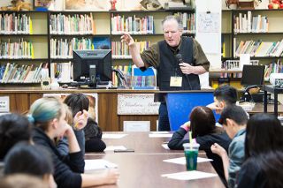 Marcus Larson/News-Register ##
Oregon Poet Laureate Kim Stafford talks with Patton Middle School students about the value of writing poetry. “A poem helps you answer a question,” he said. Marcus Larson/News-Register ##
Oregon Poet Laureate Kim Stafford talks with Patton Middle School students about the value of writing poetry. “A poem helps you answer a question,” he said.