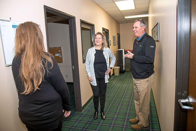 Rusty Rae/News-Register##Cami Nyquist, center, talks with eBay s Brian Burke and Michelle Warvel in MacHub’s new office space, the former News-Register offices on Third Street. The nonprofit MacHub will move some of its functions to downtown McMinnville this spring.