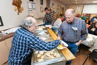 Marcus Larson News-Register ## American Legion volunteer Terry Naig serves Ken Godwin a biscuit during the Battle of the Branches breakfast last Satur- day. Navy and Coast Guard veterans were joined by members of other branches for the event.