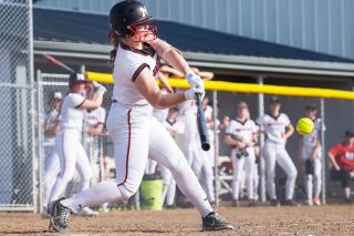 Marcus Larson/News-Register##
McMinnville’s Brynn McManus connects for her third hit of the day, a single through the left side in the fourth inning of Thursday’s 12-2 triumph over Sunset. The senior shortstop also slugged two home runs.