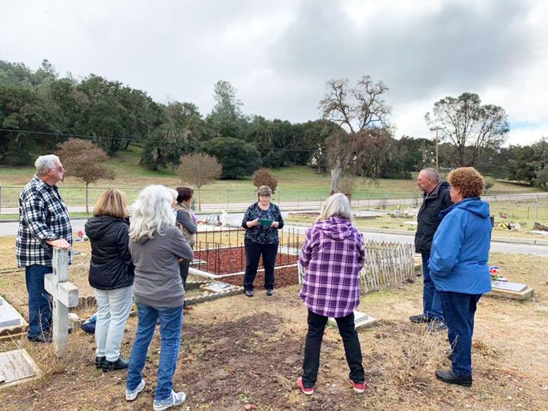 Photos courtesy Cheri Roe##Pam Parsons speaks at a headstone dedication at Santa Margarita Cemetery on Saturday, March 7, 2020, for McMinnville murder victim Cheryl Manning. The grave had no permanent marker for more than 40 years.