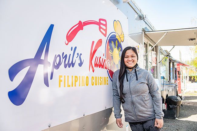 Rusty Rae/News-Register ##
April Smithburg operates her food truck, April’s Kusina, in the Grocery Outlet parking lot. Working with her sister, Precious Gould, she serves traditional Filipino food.