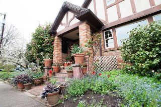 Marcus Larson/News-Register
Making the most of both her city location and the ambiance of her 1930s home, Joan Drabkin uses potted bulbs, flower beds and brick paths to charming effect.