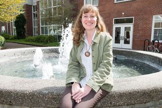 Marcus Larson/News-Register##Debbie Harmon Ferry on a rare day when she’s not wearing purple, one of Linfield’s school colors. She serves as the college’s director of alumni services. Marcus Larson/News-Register##Debbie Harmon Ferry on a rare day when she’s not wearing purple, one of Linfield’s school colors. She serves as the college’s director of alumni services.