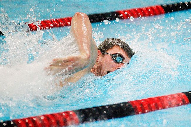 Rockne Roll/News-Register##
McMinnville’s Garrett Sutton competes in the 100-yard freestyle during a home meet Jan. 25 at the McMinnville Aquatic Center. Sutton won the 50-freestyle state title in 2018.