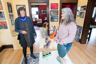 Marcus Larson/News-Register##Sculptor Jeanne Drevas and photographer Jodi Kneeland discuss their joint show, which they were seeing for the first time. Marcus Larson/News-Register##Sculptor Jeanne Drevas and photographer Jodi Kneeland discuss their joint show, which they were seeing for the first time.