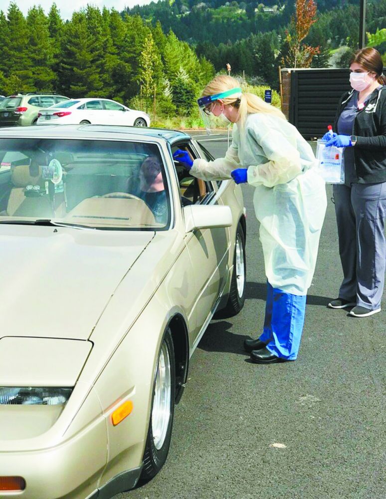 File photo##Drive-up testing at Providence Newberg Medical Center in April 2020.