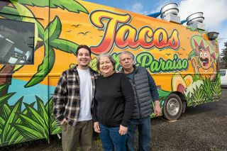 Rachel Thompson/News-Register##Jason Gonzalez and his parents, Juan Gonzalez and Rosalba Gonzalez-Carrillo, have returned to McMinnville with their food truck, Tacos El Paraiso, which is decorated with paintings of agave. The truck is typically parked at Lafayette Avenue and 13th Street.