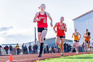Marcus Larson/News-Register##
McMinnville’s Charlotte Terry leads the pack in her 800 meter race, placing first overall with a time of two minutes, 22.89 seconds.