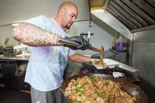 Marcus Larson/News-Register ## J.P. Kloninger prepares a serving of his famous fried rice, one of the dishes he and his wife serve out of their food truck, Hawaii Five-O-Three. Marcus Larson/News-Register ## J.P. Kloninger prepares a serving of his famous fried rice, one of the dishes he and his wife serve out of their food truck, Hawaii Five-O-Three.