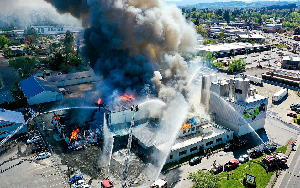 Jake Volz/Eagle Eye Droneography##Smoke fills the sky from the three-alarm fire at McMinnville’s Organic Valley Creamery on North Highway 99W. Between 75 and 100 firefighters from 10 agencies fought the April 20 blaze.