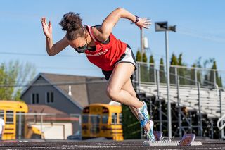 Marcus Larson/News-Register##
Mac freshman Allinah Williams explodes out of the blocks to get a quick start in the girls’ 200m sprint, which she won in 29:01 seconds.