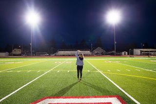 Marcus Larson/News-Register##
McMinnville High School principal Amy Fast flashes the heart symbol to cars as they pass by Wortman Stadium on McDonald Lane last Friday. School officials turned on all athletic facility lights to celebrate the student-athletes of the graduating class of 2020. Administrations at Amity, Dayton, Sheridan, Willamina and Yamhill-Carlton have all shown support in a similar manner for athletes that lost their final seasons to COVID-19 concerns. Marcus Larson/News-Register##
McMinnville High School principal Amy Fast flashes the heart symbol to cars as they pass by Wortman Stadium on McDonald Lane last Friday. School officials turned on all athletic facility lights to celebrate the student-athletes of the graduating class of 2020. Administrations at Amity, Dayton, Sheridan, Willamina and Yamhill-Carlton have all shown support in a similar manner for athletes that lost their final seasons to COVID-19 concerns.