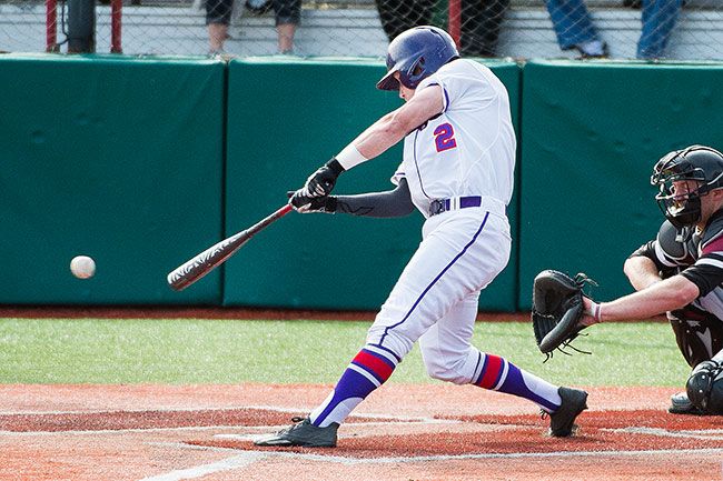 Marcus Larson/News-Register
Linfield s #2 hits a game tying RBI double in the bottom of the ninth.