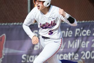 Marcus Larson/News-Register##
Linfield’s Claire Seats pumps her fist as she rounds third base after hitting a three-run walk-off home run in Saturday’s exciting NWC tournament game against rival George Fox. The Wildcats went on to capture the championship with a 4-3 victory over PLU on Sunday.