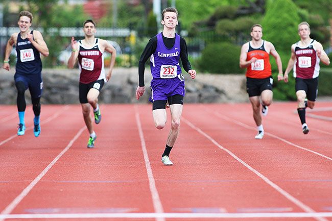 News-Register file photo##
Linfield junior Jake Mihelic (center) clocked a personal-best 400-meter time of 47.07 seconds to win his event at the NCAA Division III Outdoor Track & Field Championships in Canton, New York, in May.