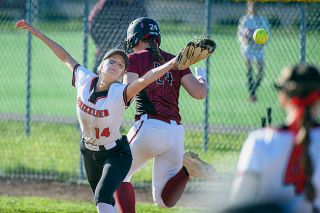 Rusty Rae/News-Register##McMinnville first base player Mya Stigall grimaces as an errant throw to first base richochets off her glove, one of several errors in the Grizzlies contest against Glencoe Tuesday on their home field, a 9-7 loss.