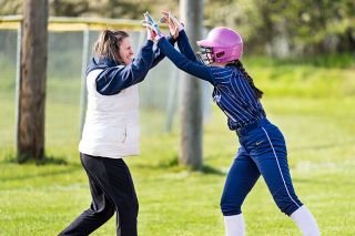 Marcus Larson/News-Register##
Sheridan head softball coach Carrie Nielsen celebrates with her daughter, Addison, after the freshman hit a fourth-inning triple during Tuesday’s 14-4 home win over Central Linn. Marcus Larson/News-Register##
Sheridan head softball coach Carrie Nielsen celebrates with her daughter, Addison, after the freshman hit a fourth-inning triple during Tuesday’s 14-4 home win over Central Linn.